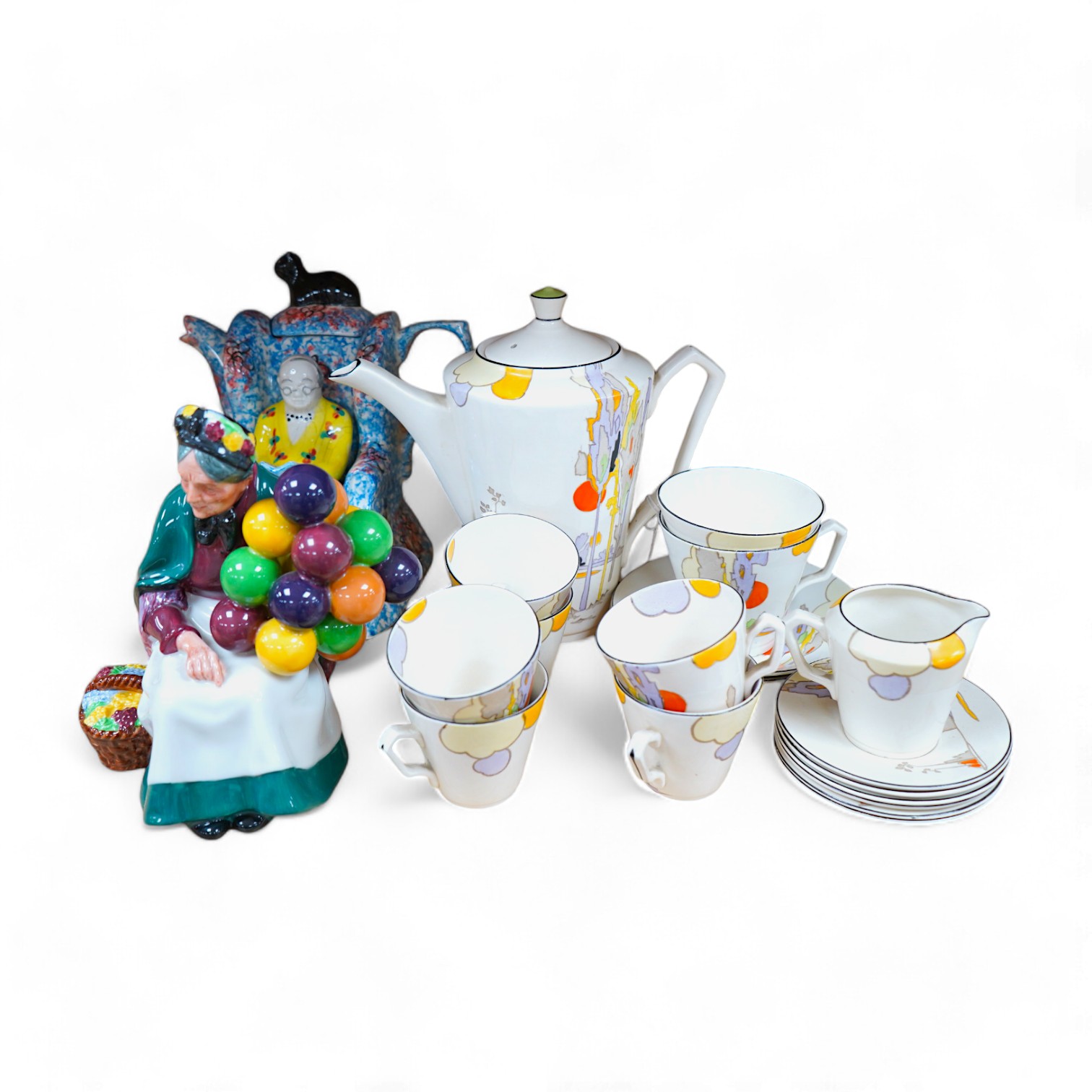 A Royal Doulton figure, 'Balloon seller', a Tams ware part coffee set and a Swineside teapot. Condition - fair